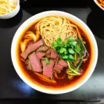 A table setting of Bun Bo Hue